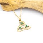 Gold Trinity Knot Necklace With Emeralds