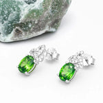 Silver Trinity Knot Stud Earrings With Green Cubic Zirconia