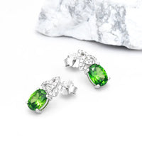 Silver Trinity Knot Stud Earrings With Green Cubic Zirconia